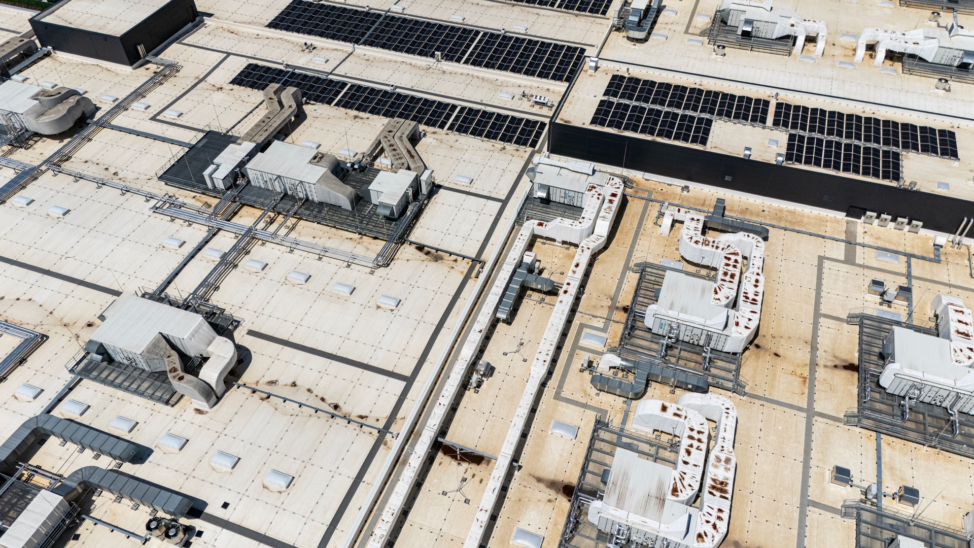 Aerial View of Factory Roof with Solar Panels and HVAC Units